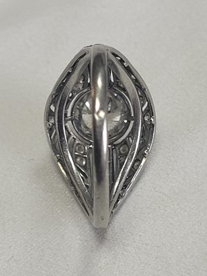 Lot 69 - A French Art Deco platinum and diamond bombé ring