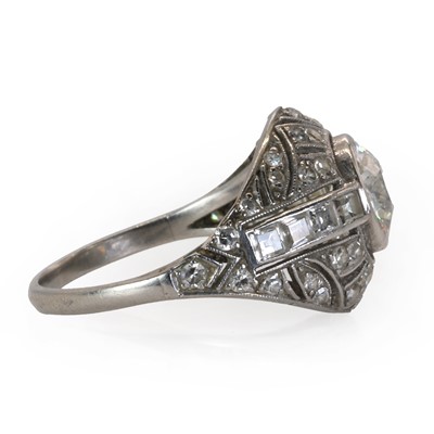 Lot 69 - A French Art Deco platinum and diamond bombé ring