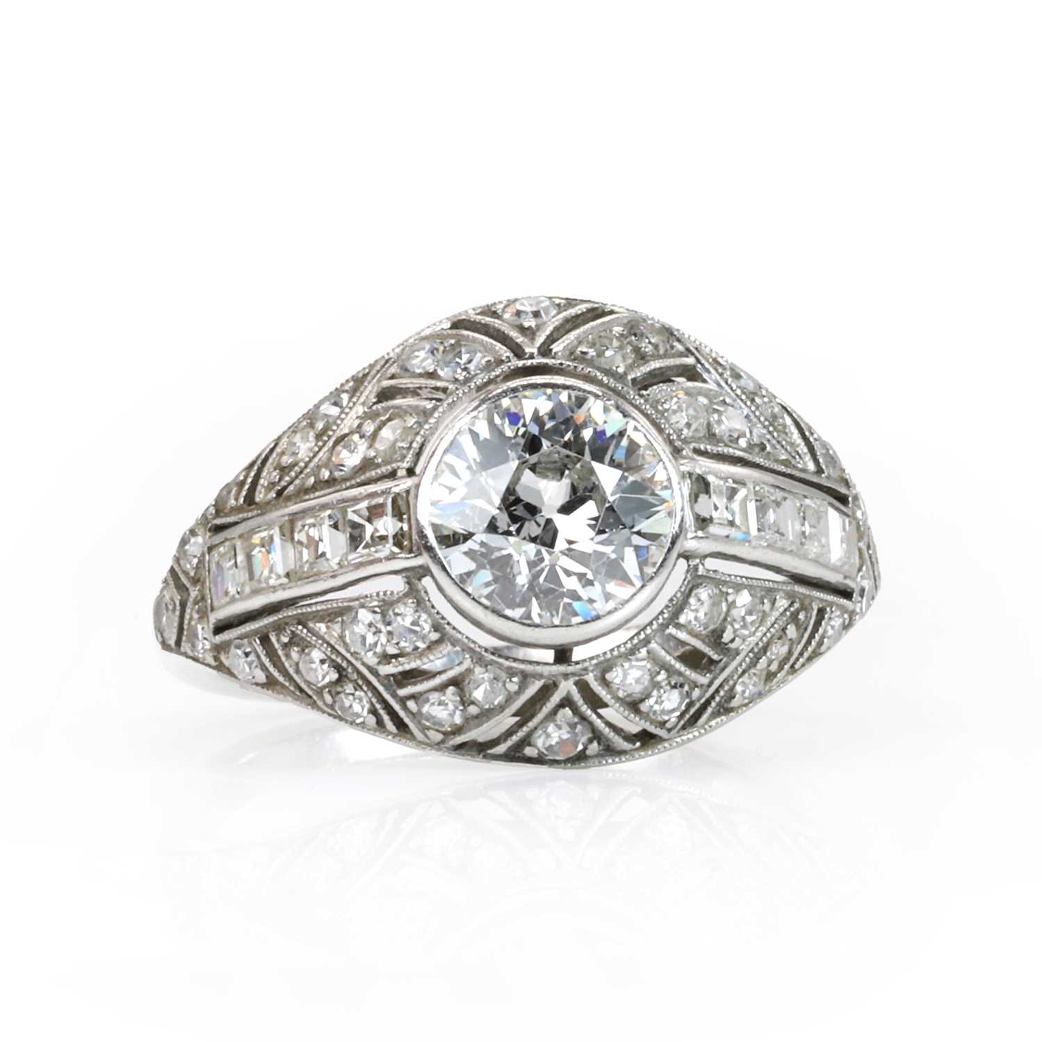 Lot 69 - A French Art Deco platinum and diamond bombé ring