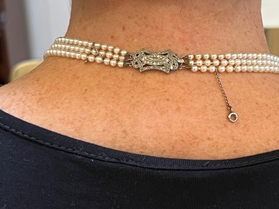 Lot 213 - A three row cultured pearl necklace, c.1930
