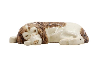 Lot 185 - A Royal Doulton Lambeth stoneware dog