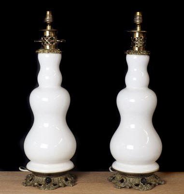 Lot 477 - A pair of earthenware and brass mounted table lamps