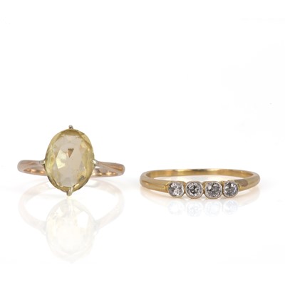Lot 162 - A four stone diamond ring and a citrine ring