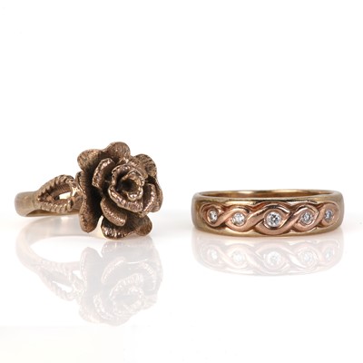 Lot 153 - A 9ct gold five stone diamond Celtic knot ring and a gold rose ring