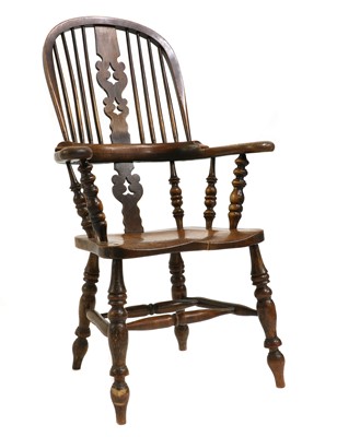 Lot 421 - An elm Windsor chair