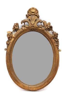 Lot 371 - A Victorian carved and gilt oak mirror