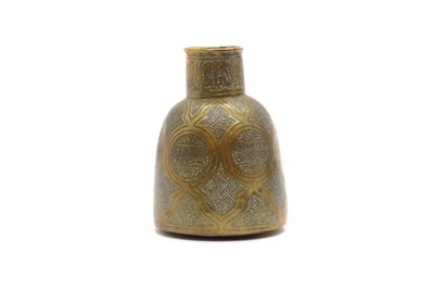 Lot 56 - An Islamic brass jug