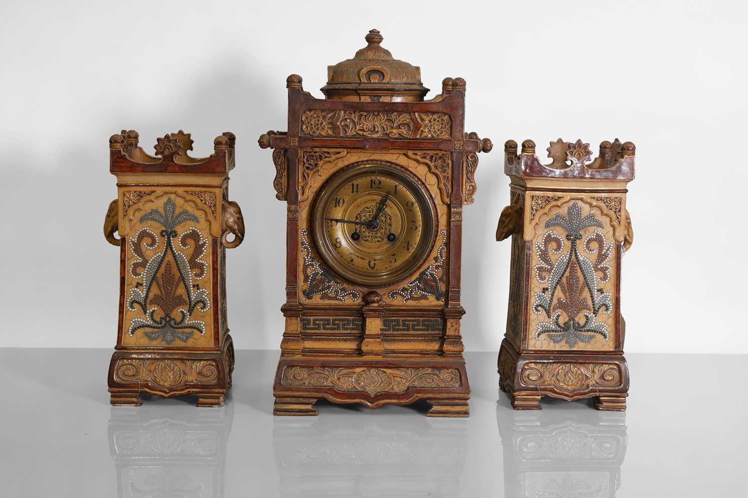 Lot 98 - A Doulton Lambeth clock garniture