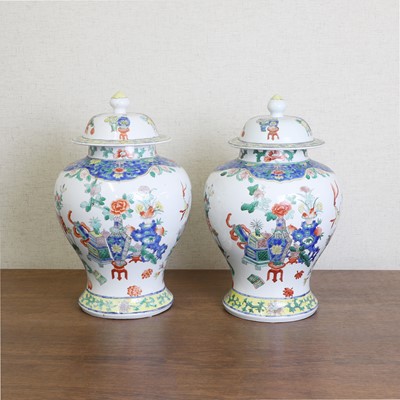 Lot 175 - A pair of Chinese famille verte vases and covers