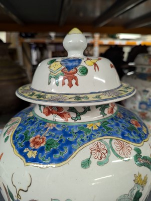 Lot 175 - A pair of Chinese famille verte vases and covers