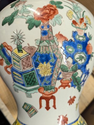 Lot 175 - A pair of Chinese famille verte vases and covers