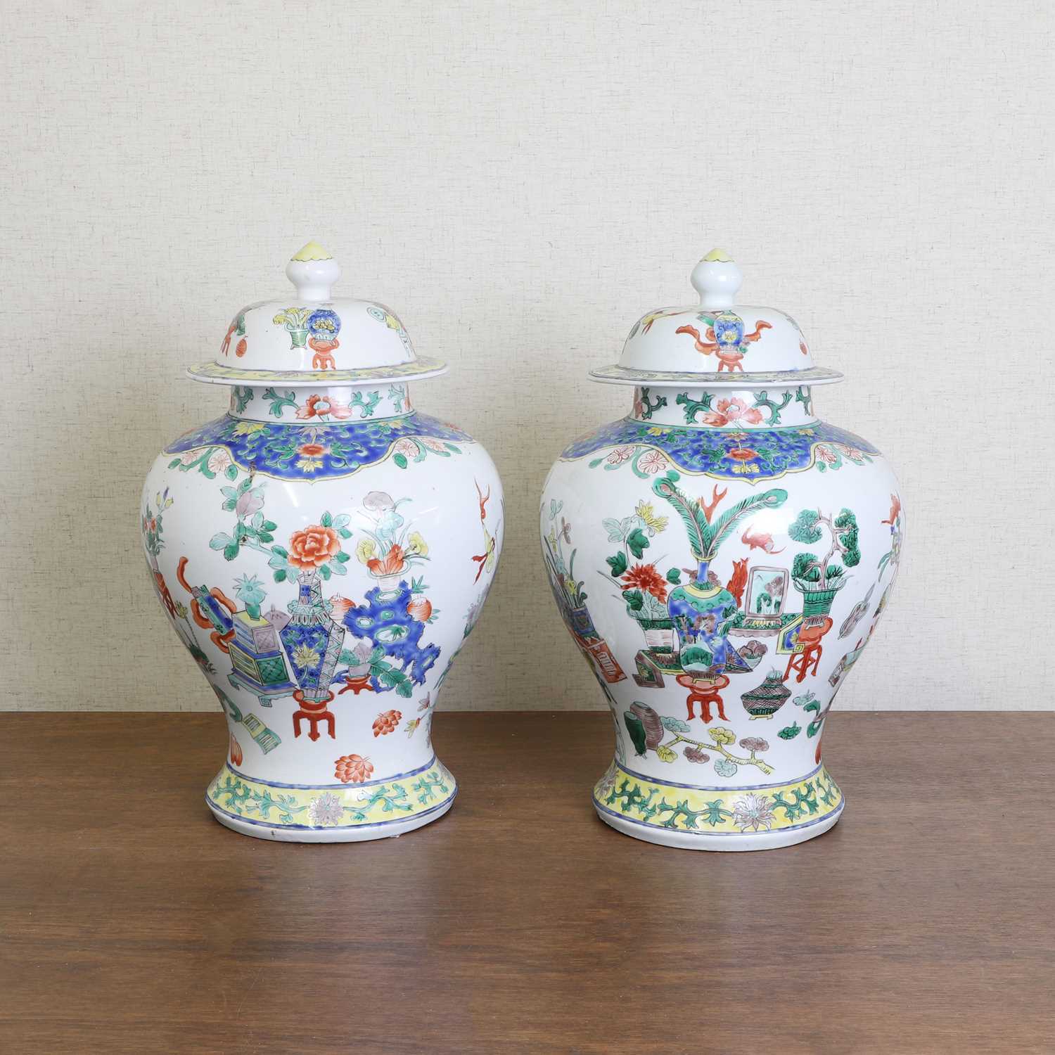 Lot 175 - A pair of Chinese famille verte vases and covers