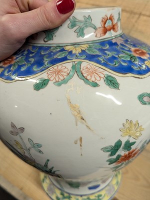 Lot 175 - A pair of Chinese famille verte vases and covers