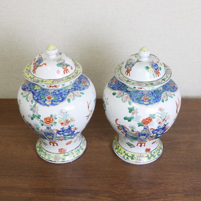 Lot 175 - A pair of Chinese famille verte vases and covers