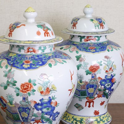 Lot 175 - A pair of Chinese famille verte vases and covers