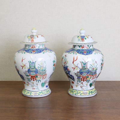 Lot 175 - A pair of Chinese famille verte vases and covers