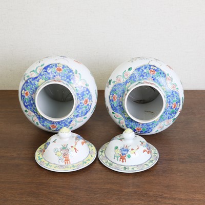 Lot 175 - A pair of Chinese famille verte vases and covers