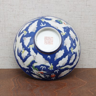 Lot 74 - Three Chinese blue-ground white-enamelled bowls