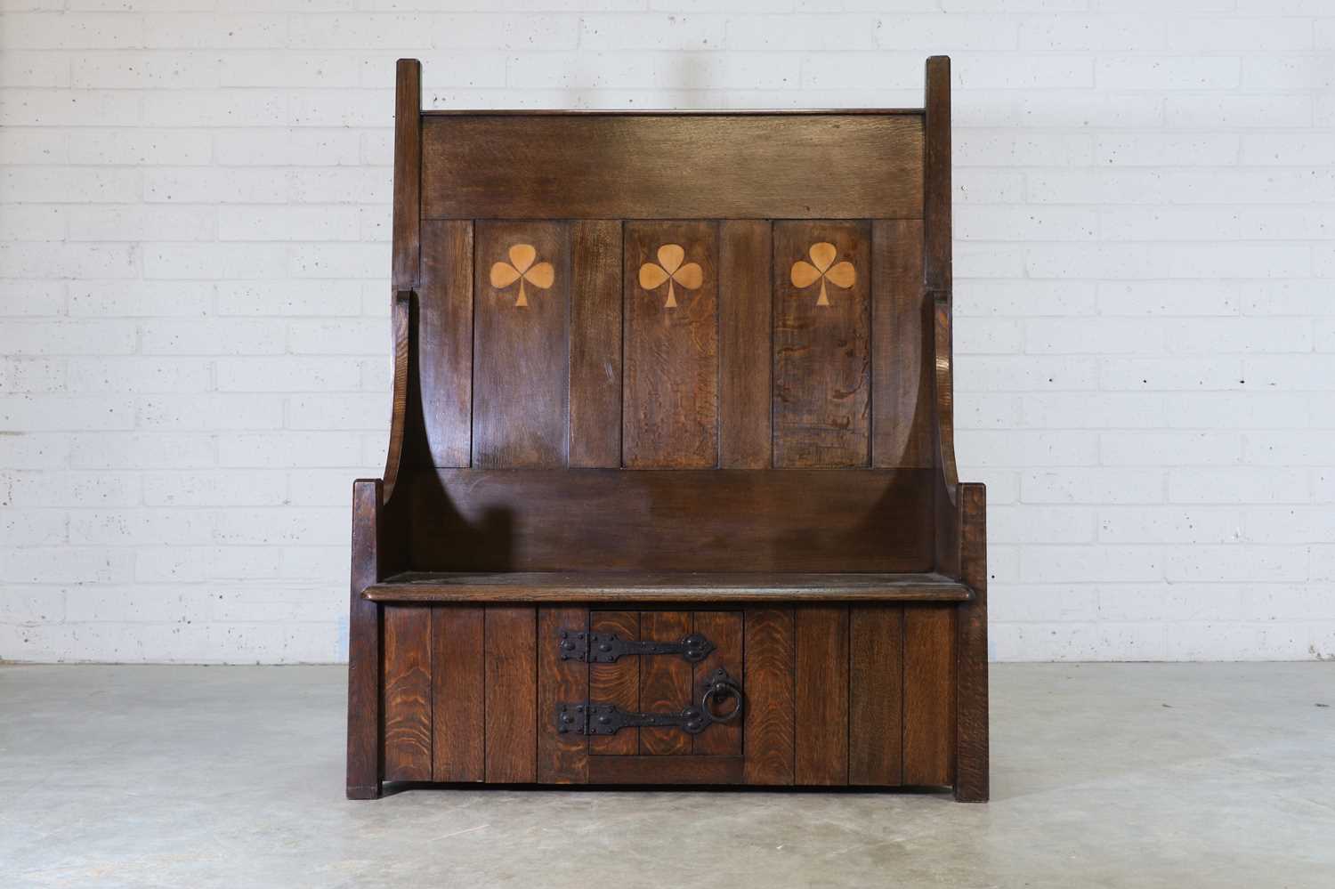 Lot 92 - A Liberty & Co. inlaid oak hall settle