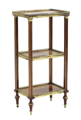 Lot 416 - A mahogany and brass bound etagere