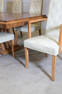 Lot 143 - A French Art Deco walnut dining suite