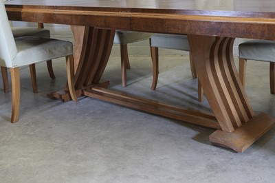 Lot 143 - A French Art Deco walnut dining suite