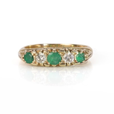 Lot 86 - A gold five stone emerald and diamond ring