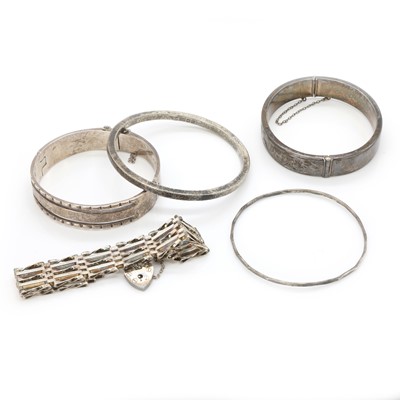 Lot 236 - A group of silver bangles and a silver gate bracelet