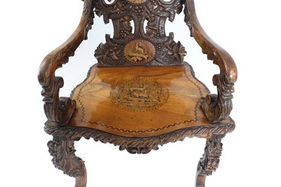 Lot 369 - A carved Black Forest elbow chair