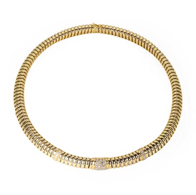 Lot 205 - A two-colour diamond Cartier Tubogas collar necklace