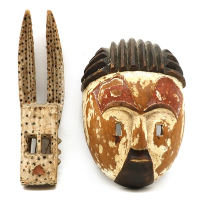 Lot 260 - Two carved West African masks