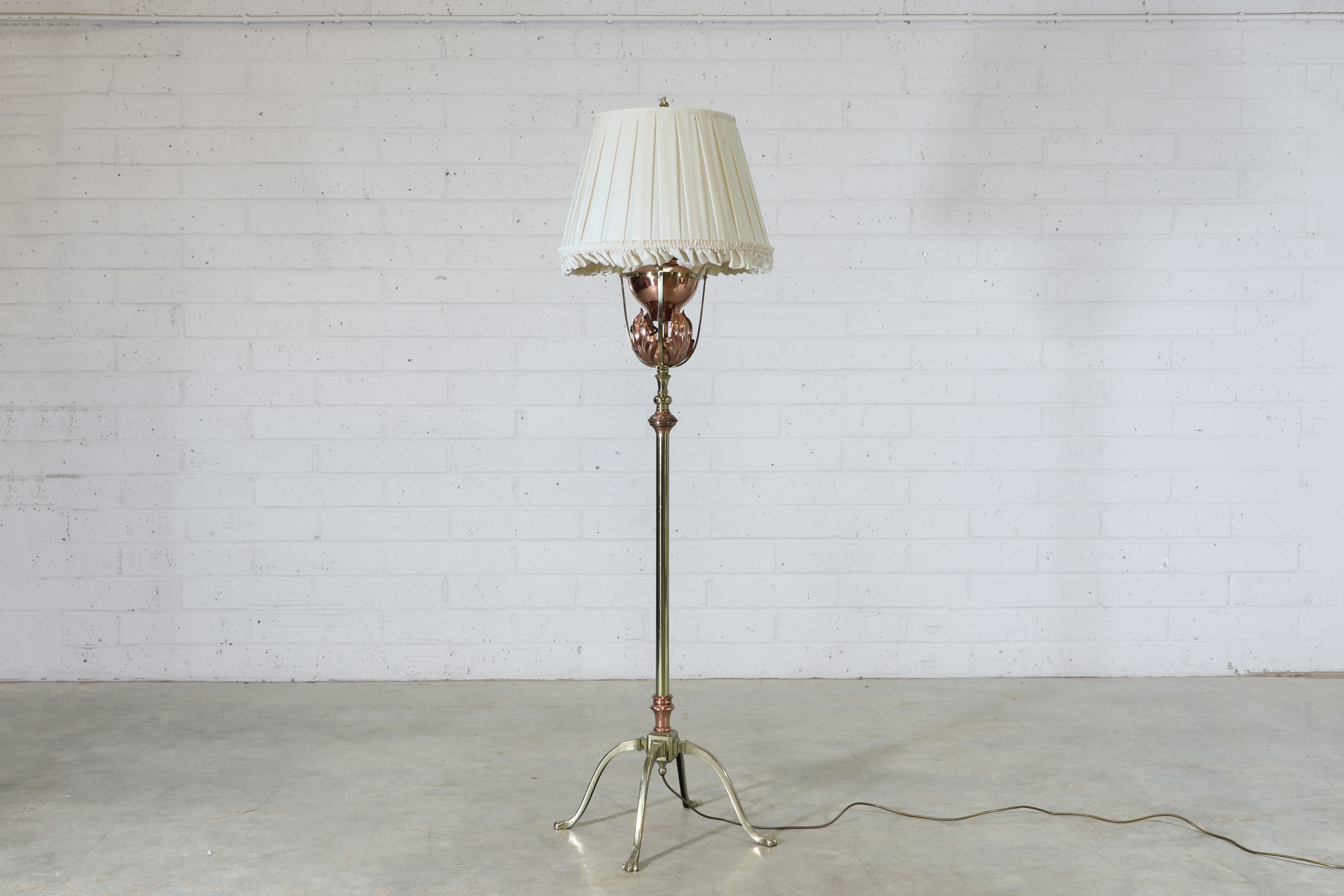 Lot 99 - A WAS Benson copper and brass standard lamp,