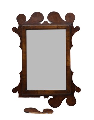 Lot 365 - A walnut fret cut mirror