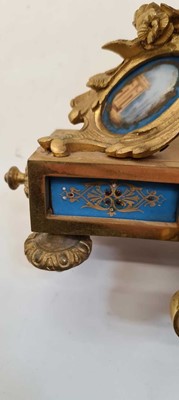 Lot 217 - An ormolu and porcelain mantel clock