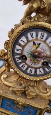Lot 217 - An ormolu and porcelain mantel clock