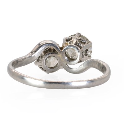 Lot 62 - A platinum and diamond Toi Et Moi ring, c.1930