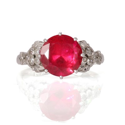Lot 17 - A white gold synthetic ruby and diamond set ring