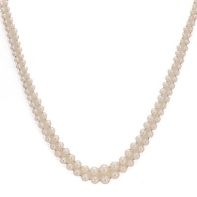 Lot 130 - A two row graduated cultured pearl necklace with diamond set clasp