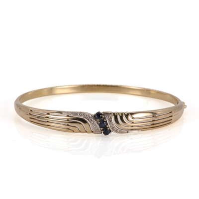 Lot 108 - A gold sapphire and diamond hinged bangle