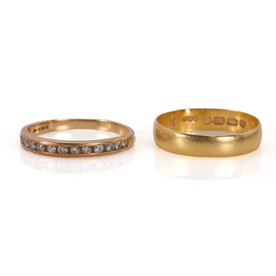Lot 173 - A 22ct gold wedding band and a half eternity ring