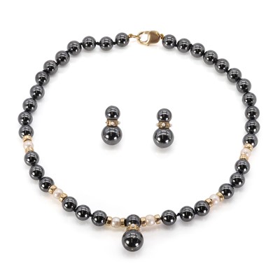 Lot 158 - A haematite and cultured pearl necklace and earrings set