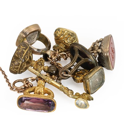Lot 263 - A rose gold bracelet suspending assorted fob seals and watch keys