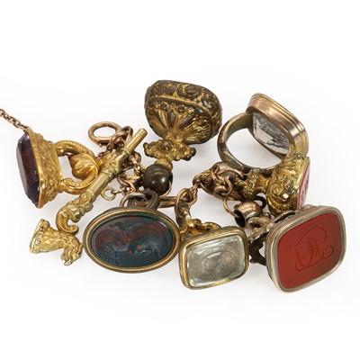 Lot 263 - A rose gold bracelet suspending assorted fob seals and watch keys