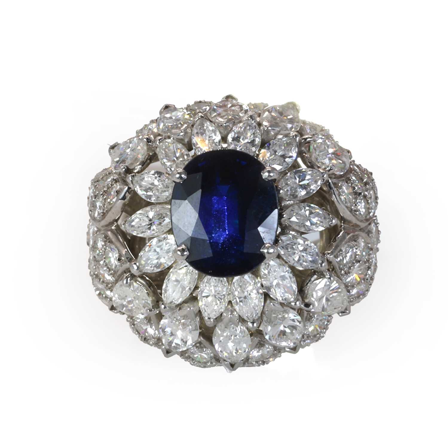 Lot 86 - A mid 20th century sapphire and diamond bombé ring