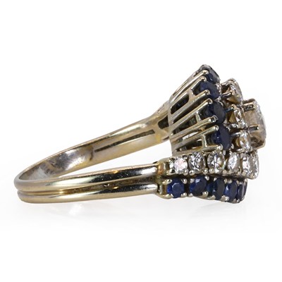 Lot 85 - A white gold sapphire and diamond crossover ring