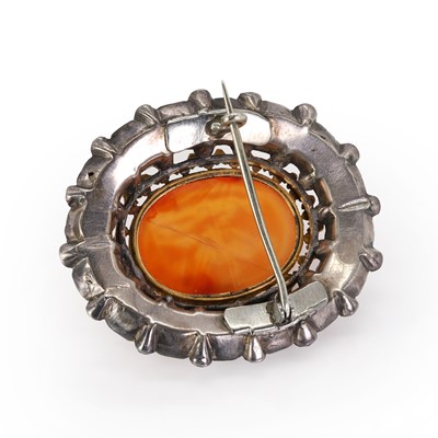 Lot 4 - A silver mounted black dot paste and carnelian intaglio brooch