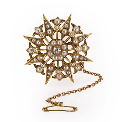 Lot 29 - An Edwardian seed pearl and diamond starburst brooch/pendant