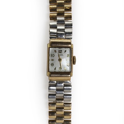 Lot 422 - A ladies' bicoloured Girard Perregaux mechanical bracelet watch