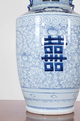 Lot 67 - A pair of blue and white porcelain table lamps