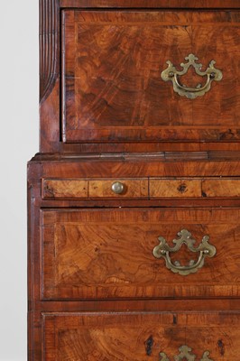 Lot 25 - A George II figured walnut secretaire chest on chest